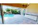 Relaxing pool area with waterfall and outdoor kitchen at 220 Shreve St, Punta Gorda, FL 33950