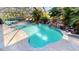 Enclosed pool and spa with a waterfall feature at 220 Shreve St, Punta Gorda, FL 33950