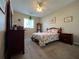 Comfortable bedroom with carpeted floor and ceiling fan at 24157 Green Heron Dr # 27, Punta Gorda, FL 33980