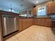 Well-equipped kitchen with wood cabinets and tiled floors at 24157 Green Heron Dr # 27, Punta Gorda, FL 33980