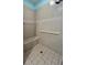 Walk-in shower with grab bars and tiled walls at 24157 Green Heron Dr # 27, Punta Gorda, FL 33980