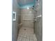 Large walk-in shower with grab bars and tiled walls at 24157 Green Heron Dr # 27, Punta Gorda, FL 33980