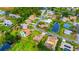 Community features various houses, lush landscaping, and a lake at 245 Brighton Ct, Englewood, FL 34223