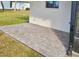 Side patio with brick pavers adjacent to the house at 245 Brighton Ct, Englewood, FL 34223