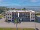 Aerial view of waterfront condo community, highlighting building location and surrounding landscape at 25188 Marion Ave # E103, Punta Gorda, FL 33950