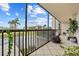 Screened balcony overlooking a lush green golf course at 25188 Marion Ave # E103, Punta Gorda, FL 33950