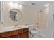 Clean bathroom with walk-in shower, toilet and vanity at 25188 Marion Ave # E103, Punta Gorda, FL 33950