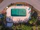 An aerial view of a community pool with lounge chairs at 25188 Marion Ave # E103, Punta Gorda, FL 33950