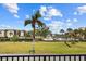 Scenic waterfront view with lush landscaping and boats at 25188 Marion Ave # E103, Punta Gorda, FL 33950