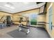 Spacious fitness center with weightlifting equipment, free weights, and a mirrored wall for exercise routines at 255 W End Dr # 4210, Punta Gorda, FL 33950