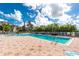 Inviting swimming pool surrounded by a spacious deck and lush landscaping, offering a refreshing and relaxing escape at 255 W End Dr # 4210, Punta Gorda, FL 33950