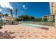 Outdoor shuffleboard court with a covered seating area and lush tropical landscaping at 255 W End Dr # 4210, Punta Gorda, FL 33950