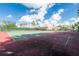 Exterior view of tennis courts with manicured landscaping and sunny skies at 255 W End Dr # 4210, Punta Gorda, FL 33950