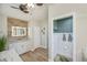 Bright bathroom with white cabinets and a separate toilet area at 269 Mariner Ln, Rotonda West, FL 33947