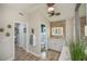 Bathroom with double sinks, linen closet and view into another room at 269 Mariner Ln, Rotonda West, FL 33947