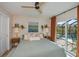 King bedroom with pool access and updated ceiling fan at 269 Mariner Ln, Rotonda West, FL 33947