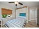 Cozy bedroom with a murphy bed and plenty of natural light at 269 Mariner Ln, Rotonda West, FL 33947