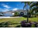 Single-Gathering home exterior with a three-car garage and landscaping at 269 Mariner Ln, Rotonda West, FL 33947