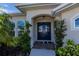 Elegant double front doors with a decorative archway at 269 Mariner Ln, Rotonda West, FL 33947