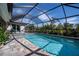 Inviting screened pool area, perfect for relaxation and entertaining at 269 Mariner Ln, Rotonda West, FL 33947