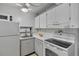 Cozy kitchen with white appliances and ample counter space at 2763 Woodgate Ln # 206, Sarasota, FL 34231