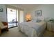 Guest bedroom with private balcony access at 3000 Peace River Dr, Punta Gorda, FL 33983