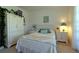 Charming bedroom with white furniture and soft bedding at 3000 Peace River Dr, Punta Gorda, FL 33983