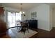 Dining area with round table and chairs, access to a screened porch and kitchen at 3000 Peace River Dr, Punta Gorda, FL 33983