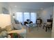 Living room with beige couch, wicker chairs, and a coffee table at 3000 Peace River Dr, Punta Gorda, FL 33983