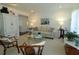 Living room with light beige couch and wicker chairs at 3000 Peace River Dr, Punta Gorda, FL 33983