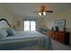 Main bedroom with water views and dresser at 3000 Peace River Dr, Punta Gorda, FL 33983