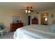 Main bedroom with dresser and access to bathroom at 3000 Peace River Dr, Punta Gorda, FL 33983