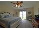 Main bedroom with water views and private access to balcony at 3000 Peace River Dr, Punta Gorda, FL 33983