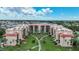 Aerial view of a condo building with swimming pool and surrounding landscape at 3006 Caring Way # 331, Port Charlotte, FL 33952