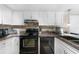 Well-equipped kitchen featuring stainless steel appliances and dark countertops at 3006 Caring Way # 331, Port Charlotte, FL 33952