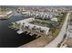 Aerial view of waterfront condo community with tennis court and pool at 3600 Bal Harbor Blvd # 1A, Punta Gorda, FL 33950