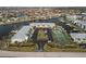 Aerial view of waterfront condo community with tennis court and pool at 3600 Bal Harbor Blvd # 1A, Punta Gorda, FL 33950