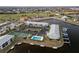 Aerial view of waterfront condo community with tennis court and pool at 3600 Bal Harbor Blvd # 1A, Punta Gorda, FL 33950