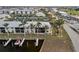 Waterfront condo building with private boat dock and lush landscaping at 3600 Bal Harbor Blvd # 1A, Punta Gorda, FL 33950