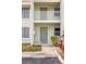 Condo building entrance with private balconies and landscaping at 3600 Bal Harbor Blvd # 1A, Punta Gorda, FL 33950