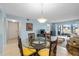 Bright dining area with a view of the living room and sliding doors at 3600 Bal Harbor Blvd # 1A, Punta Gorda, FL 33950