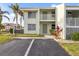 Condo building exterior showcasing a two-story unit with parking at 3600 Bal Harbor Blvd # 1A, Punta Gorda, FL 33950