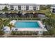 Community swimming pool with lounge chairs and waterfront views at 3600 Bal Harbor Blvd # 1A, Punta Gorda, FL 33950