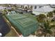 Community tennis court nestled in lush tropical landscaping at 3600 Bal Harbor Blvd # 1A, Punta Gorda, FL 33950