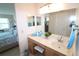 Bright bathroom featuring a vanity with sink and large mirror at 3627 Bal Harbor Blvd # 102, Punta Gorda, FL 33950