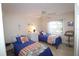 Cozy bedroom with two twin beds, offering a comfortable guest space at 3627 Bal Harbor Blvd # 102, Punta Gorda, FL 33950