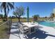 Patio furniture near community pool at 3627 Bal Harbor Blvd # 102, Punta Gorda, FL 33950