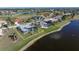 Aerial view showcasing a house with pool near lake at 3749 Bordeaux Dr, Punta Gorda, FL 33950