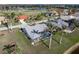 Aerial view showcasing a house, pool, and surrounding landscape at 3749 Bordeaux Dr, Punta Gorda, FL 33950