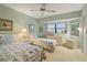 Guest bedroom with twin beds, dresser, and ceiling fan at 3749 Bordeaux Dr, Punta Gorda, FL 33950